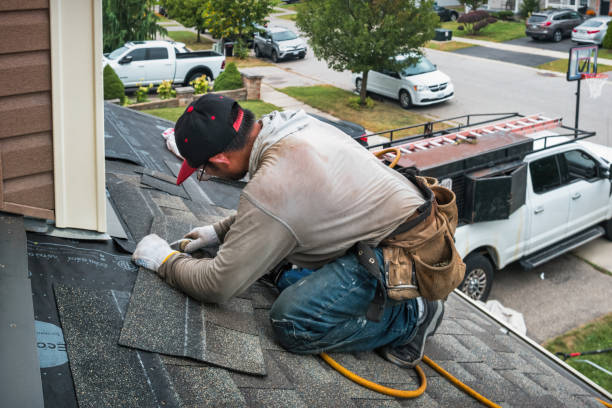 Professional Emergency Roof Repair technician working in Dover, MA